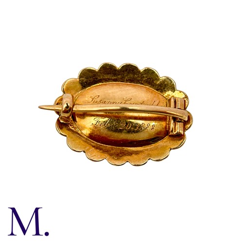 10 - A Pearl And Hairwork Mourning Brooch in yellow gold, set with woven hairwork within a pearl border, ... 