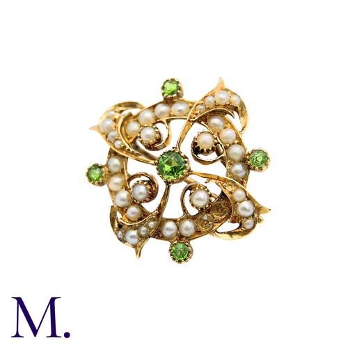 214 - A Peridot And Pearl Brooch in 15k yellow gold, the circular form set with pearls and peridot with sc... 