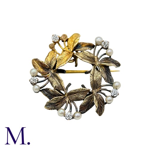 196 - A Pearl And Diamond Brooch Pendant in yellow gold, the circular, foliate wreath form set with round ... 
