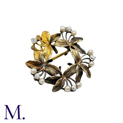 196 - A Pearl And Diamond Brooch Pendant in yellow gold, the circular, foliate wreath form set with round ... 