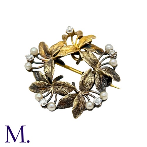 196 - A Pearl And Diamond Brooch Pendant in yellow gold, the circular, foliate wreath form set with round ... 