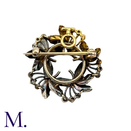 196 - A Pearl And Diamond Brooch Pendant in yellow gold, the circular, foliate wreath form set with round ... 