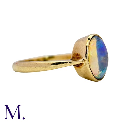3 - An Opal Ring in 9k yellow gold, set with a cabochon opal. Stamped 9ct.

Size: I1/2
Weight: 1.8g
