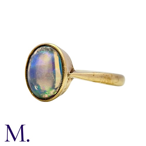 3 - An Opal Ring in 9k yellow gold, set with a cabochon opal. Stamped 9ct.

Size: I1/2
Weight: 1.8g