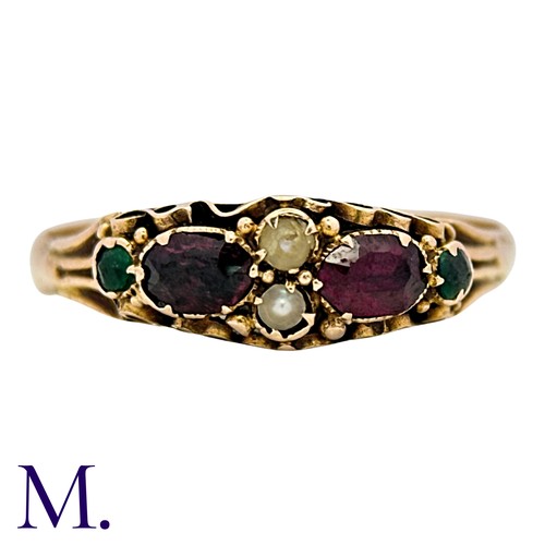 37 - An Antique Garnet, Emerald And Pearl Ring in 15k yellow gold, set with two oval cut garnets accented... 