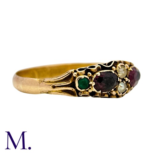 37 - An Antique Garnet, Emerald And Pearl Ring in 15k yellow gold, set with two oval cut garnets accented... 