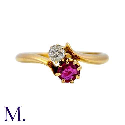 1 - A Ruby And Diamond Toi Et Moi Ring in 18k yellow gold, set with a round cut ruby and an old cut diam... 