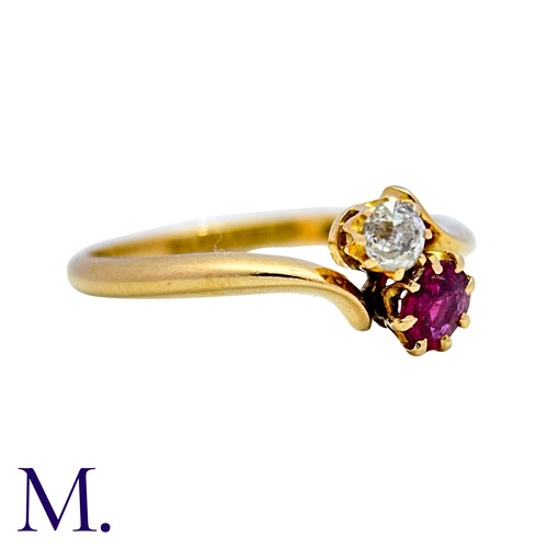 1 - A Ruby And Diamond Toi Et Moi Ring in 18k yellow gold, set with a round cut ruby and an old cut diam... 