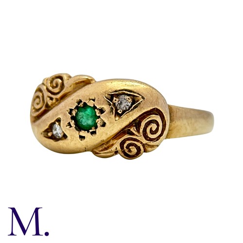 6 - An Emerald And Diamond Ring in 9k yellow gold, set with a round cut emerald flanked either side with... 