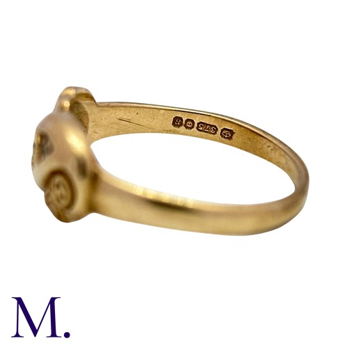 6 - An Emerald And Diamond Ring in 9k yellow gold, set with a round cut emerald flanked either side with... 