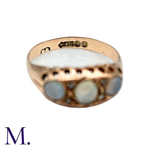 425 - An Opal And Diamond Ring in 9k yellow gold, set with three cabochon opals punctuated by pairs of ros... 