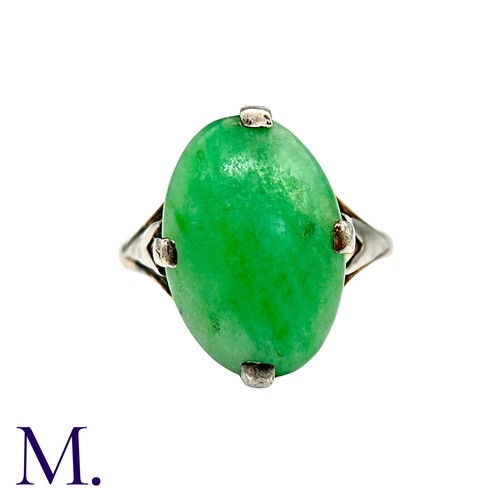 11 - A Jade Ring in 9k yellow gold, set with a cabochon piece of jade. Stamped 9ct.

Size:O1/2
Weight: 3.... 