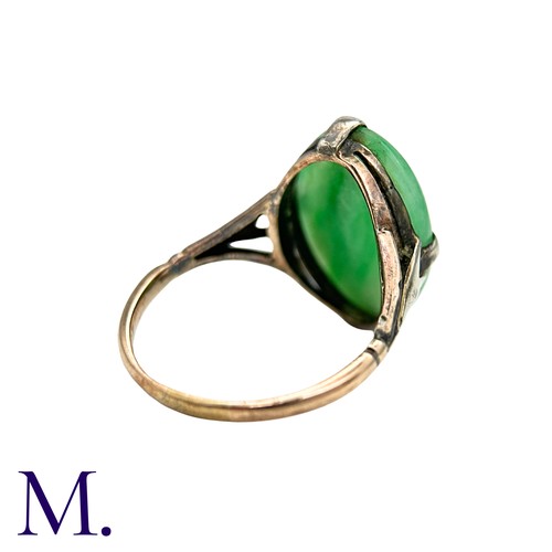 11 - A Jade Ring in 9k yellow gold, set with a cabochon piece of jade. Stamped 9ct.

Size:O1/2
Weight: 3.... 