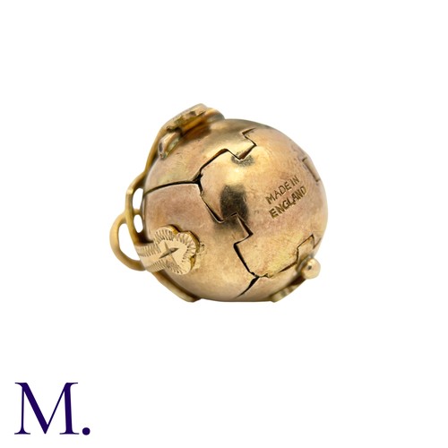 211 - A Masonic Orb Pendant in 9k yellow gold and silver, the hinged spherical body opens to display a cro... 