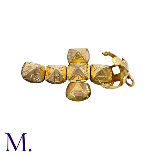 211 - A Masonic Orb Pendant in 9k yellow gold and silver, the hinged spherical body opens to display a cro... 