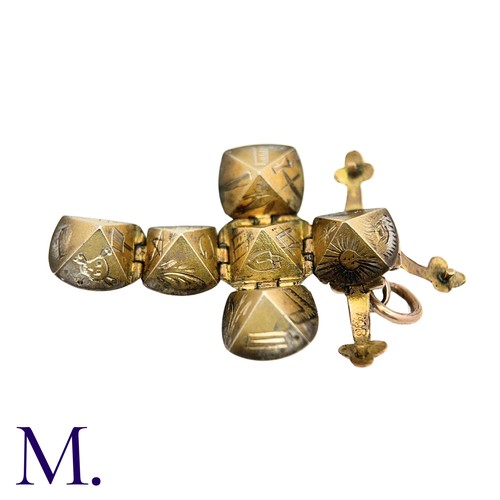 24 - A Masonic Orb Pendant in 9k yellow gold and silver, the hinged spherical body opens to display a cro... 