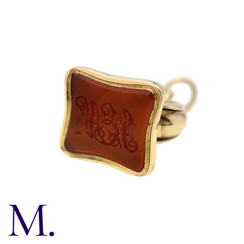 197 - An Agate Seal in yellow gold with fluted base set with orange-coloured agate with monogram.  Unmarke... 