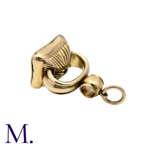 197 - An Agate Seal in yellow gold with fluted base set with orange-coloured agate with monogram.  Unmarke... 