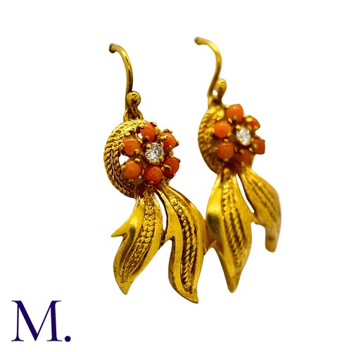 201 - A Pair of Coral and Diamond Earrings in 18K yellow gold, set with six cabochons of coral around a sm... 