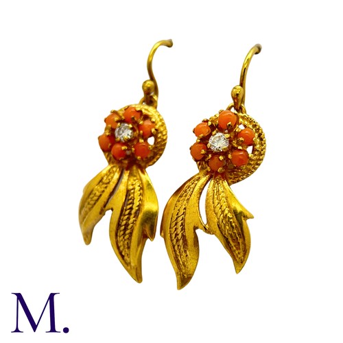 201 - A Pair of Coral and Diamond Earrings in 18K yellow gold, set with six cabochons of coral around a sm... 