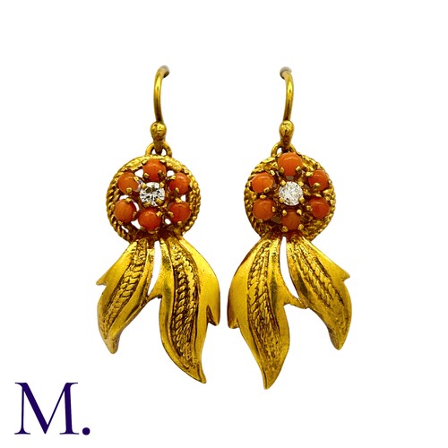 201 - A Pair of Coral and Diamond Earrings in 18K yellow gold, set with six cabochons of coral around a sm... 