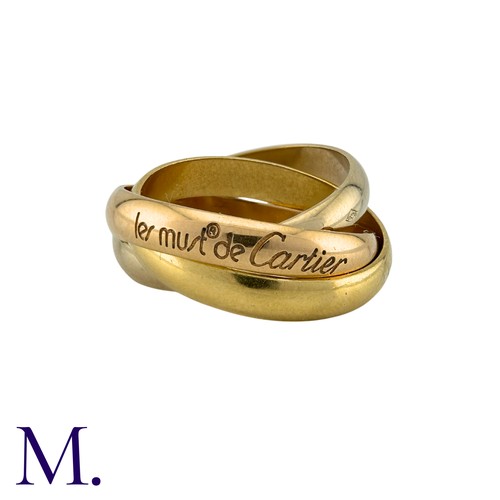 236 - CARTIER. A Cartier Trinity Ring in 18K rose, white and yellow gold.  Engraved 'Les Must de Cartier' ... 