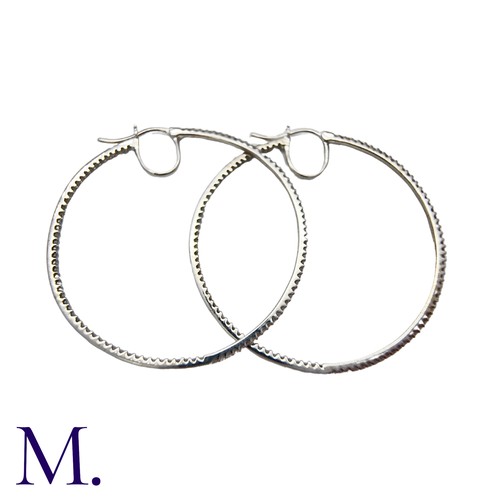 226 - A Pair of Diamond Hoop Earrings in 18K white gold, in woven textured form, set with diamonds weighin... 