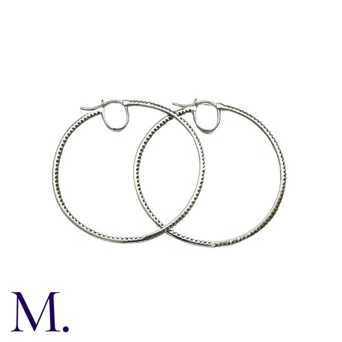 226 - A Pair of Diamond Hoop Earrings in 18K white gold, in woven textured form, set with diamonds weighin... 