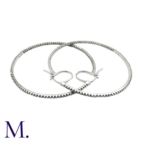 226 - A Pair of Diamond Hoop Earrings in 18K white gold, in woven textured form, set with diamonds weighin... 