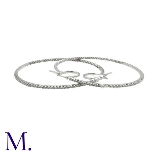 226 - A Pair of Diamond Hoop Earrings in 18K white gold, in woven textured form, set with diamonds weighin... 
