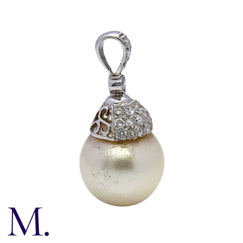 224 - A Diamond and Pearl Drop Pendant in 18K white gold, set with a round cream pearl of approximately 13... 