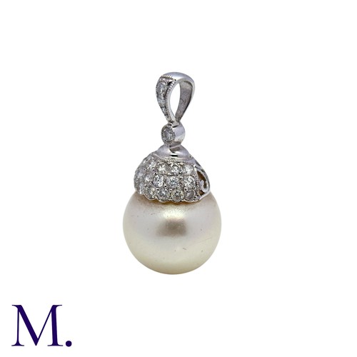 224 - A Diamond and Pearl Drop Pendant in 18K white gold, set with a round cream pearl of approximately 13... 
