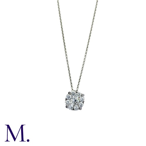 214 - A Diamond Pendant and Chain in 18K white gold.  Pendant set with a round brilliant diamond weighing ... 
