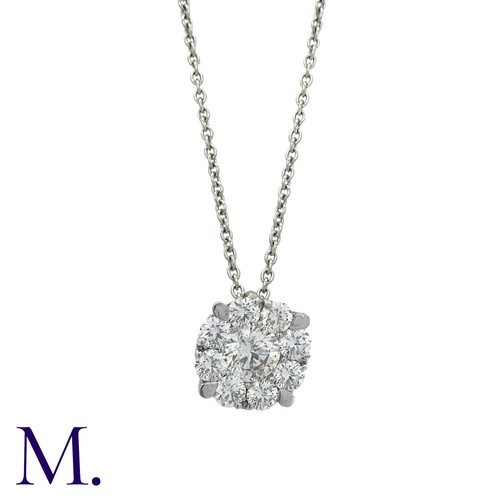 214 - A Diamond Pendant and Chain in 18K white gold.  Pendant set with a round brilliant diamond weighing ... 