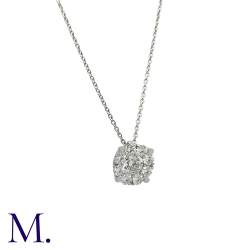 214 - A Diamond Pendant and Chain in 18K white gold.  Pendant set with a round brilliant diamond weighing ... 