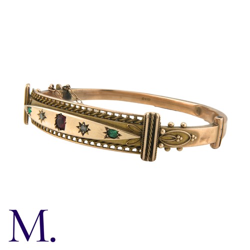 183 - A Victorian Paste Bangle in 9K rose gold, with ropework and beading motifs. Stamped 375 for 9 carat ... 