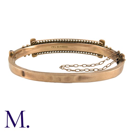 183 - A Victorian Paste Bangle in 9K rose gold, with ropework and beading motifs. Stamped 375 for 9 carat ... 