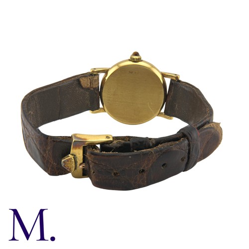 227 - JAEGER-LECOULTRE. A Gold Wristwatch, with brushed Champagne coloured dial and tigers-eye set crown. ... 