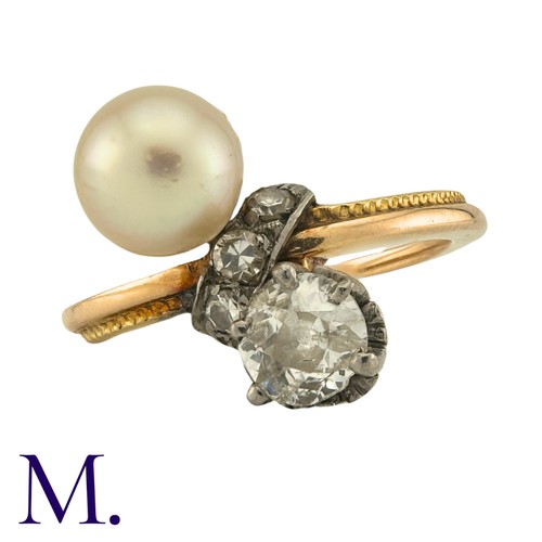 185 - A Diamond And Pearl Toi Et Moi Ring in yellow gold, set with a principal old cut diamond of approxim... 