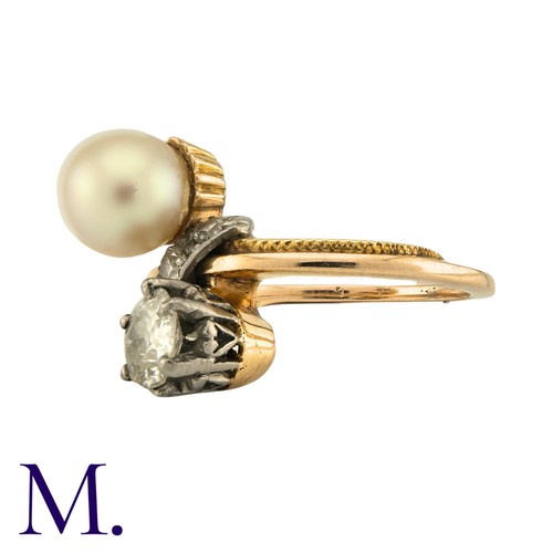 185 - A Diamond And Pearl Toi Et Moi Ring in yellow gold, set with a principal old cut diamond of approxim... 