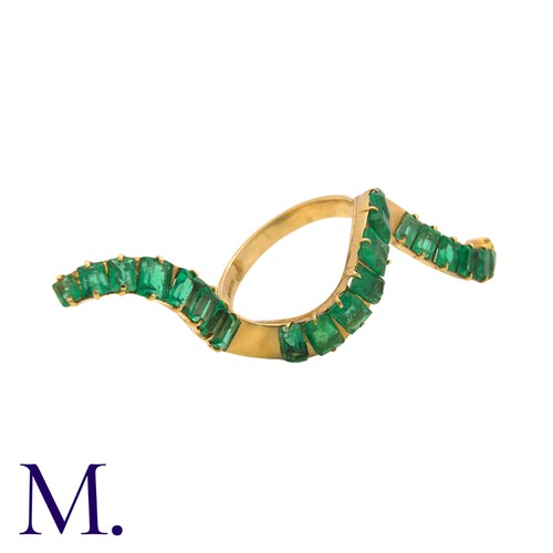 240 - An Emerald Wave Ring in 14K yellow gold, set with 23 emerald-cut emeralds (likely Colombian).  Hallm... 