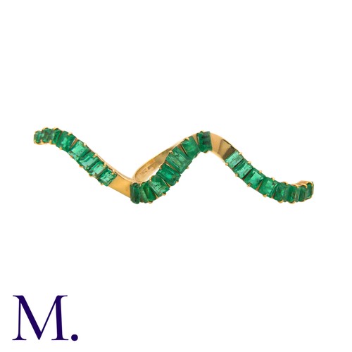 240 - An Emerald Wave Ring in 14K yellow gold, set with 23 emerald-cut emeralds (likely Colombian).  Hallm... 