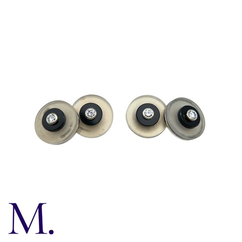 217 - A Pair of Onyx, Crystal & Diamond Cufflinks in 18K white gold, with each crystal disc inlaid with on... 