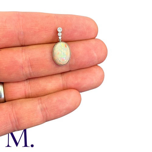 160 - An Opal And Diamond Pendant in platinum, set with a principal cabochon opal of approximately 5.00cts... 