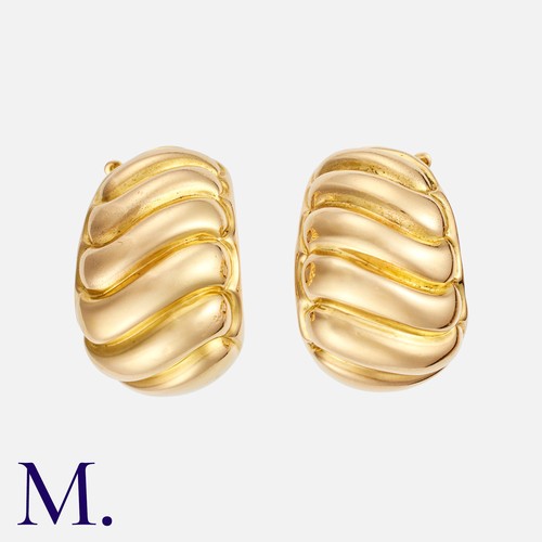 14 - VAN CLEEF & ARPELS. A Pair Of Gold Hoop Earrings in 18k yellow gold, comprising a pair of fluted, bo... 