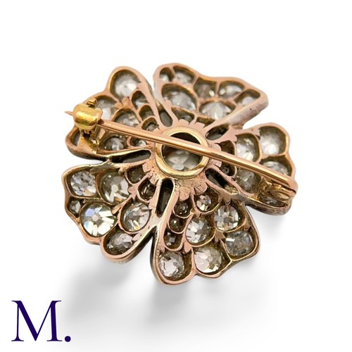 35 - An Antique Old Cut Diamond Flower Brooch in yellow gold and silver, set with old cut diamonds totall... 