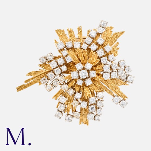 48 - CARTIER. An Important Diamond Brooch in 18K yellow gold in an abstract starburst form, set with 53 r... 