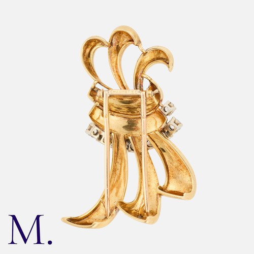 12 - CHAUMET. A 1950s Diamond Clip set in 18ct yellow gold, set with 8 old cut diamonds weighing approxim... 