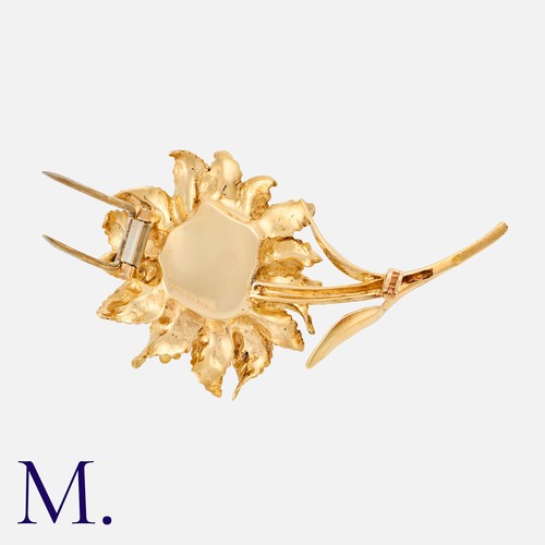 38 - HERMES. A Flower Brooch in 18K yellow gold, signed Hermes Paris and serial numbered.  French marks f... 