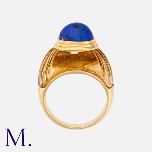 50 - BOUCHERON. A Citrine & Lapis Ring in 18k yellow gold, of bombe form, set with a carved citrine inlai... 